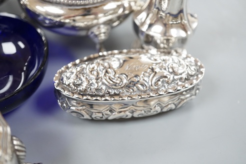 A pair of Victorian silver bun salts with blue glass liners and spoons, a spare liner, a later pair of small silver salts, a silver pepperette, a small silver box and a silver christening pair in box for three.